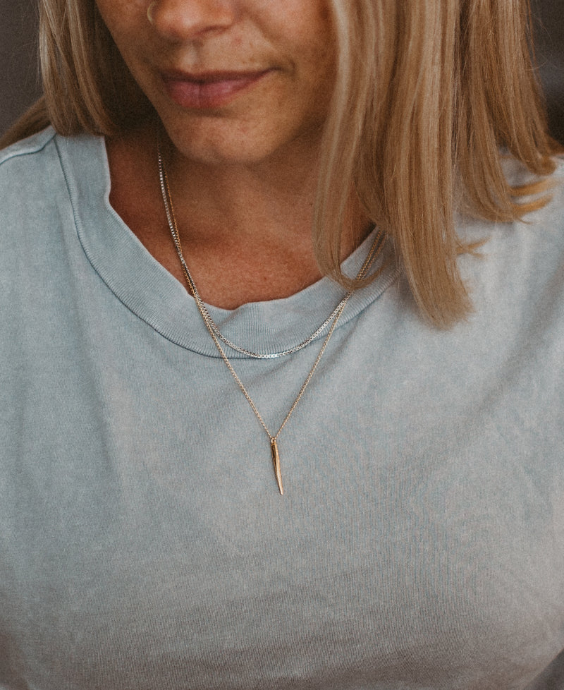 gold spear necklace